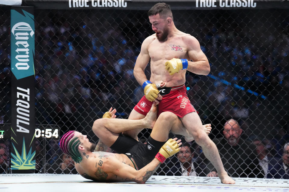 LAS VEGAS, NEVADA - SEPTEMBER 14: (R-L) Merab Dvalishvili of Georgia grapples with Sean O'Malley in the UFC bantamweight championship fight during the UFC 306 at Riyadh Season Noche UFC event at Sphere on September 14, 2024 in Las Vegas, Nevada. (Photo by Chris Unger/Zuffa LLC)